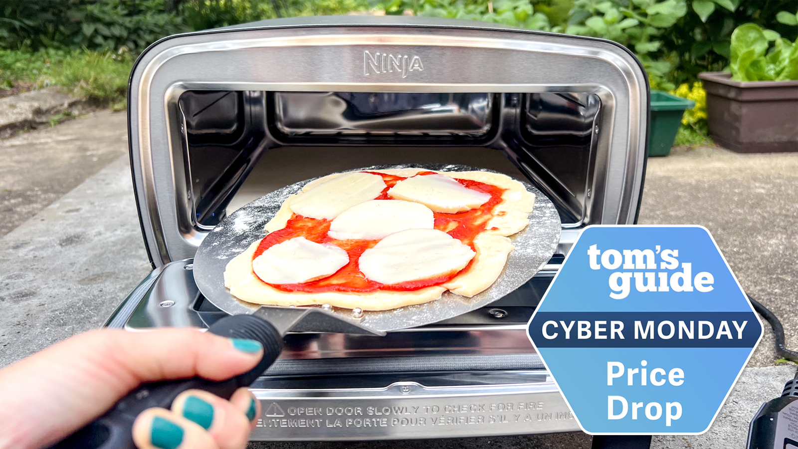 ninja artisan pizza oven with tom's guide cyber monday badge
