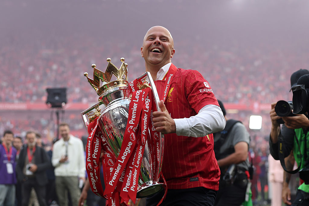 Arne Slot, Manger of Liverpool, celebrates with the Premier League trophy trophy, as Liverpool are crowned the Champions of the Premier League for the 2024/25 Season, following the Premier League match between Liverpool FC and Crystal Palace FC at Anfield on May 25, 2025 in Liverpool, England.