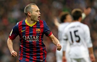 Andres Iniesta celebrates after scoring for Barcelona against Real Madrid in 2014.