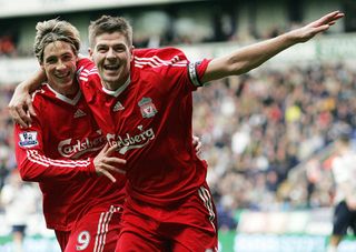 Liverpool's English midfielder Steven Gerrard (R) celebrates with Spanish forward Fernando Torres after scoring against Bolton Wanderers during their English Premier League football match at The Reebok Stadium in Bolton, on November 15, 2008. AFP PHOTO/PAUL ELLIS - FOR EDITORIAL USE ONLY Additional licence required for any commercial/promotional use or use on TV or internet (except identical online version of newspaper) of Premier League/Football League photos. Tel DataCo +44 207 2981656. Do not alter/modify photo. (Photo credit should read PAUL ELLIS/AFP via Getty Images)