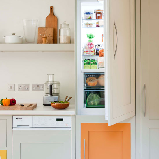 kitchen with white walls and refrigerator