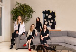 Female designers and curators Crystal Ellis, Hillary Petrie, Stephanie Beamer and Tealia Ellis Ritter on grey couch
