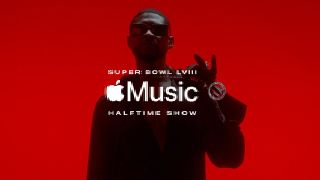 Silhouette of musician Usher against a red background with Apple Music logo in front