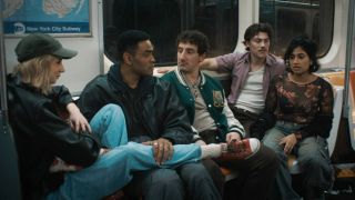 Lucy Freyer, Owen Thiele, Malik Elassal, Jack Innanen, and Amita Rao sitting on a train in Adults.