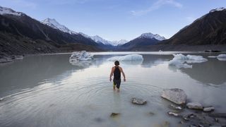 Man swimming glacial waters