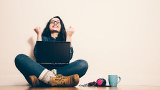 happy woman using a laptop