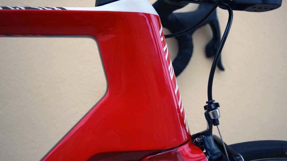 The cabling for the brakes enters the frame at the head tube