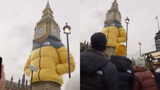 Big Ben wrapped in a yellow North Face puffer jacket