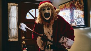 Art The Clown dressed as santa covered in blood In Terrifier 3