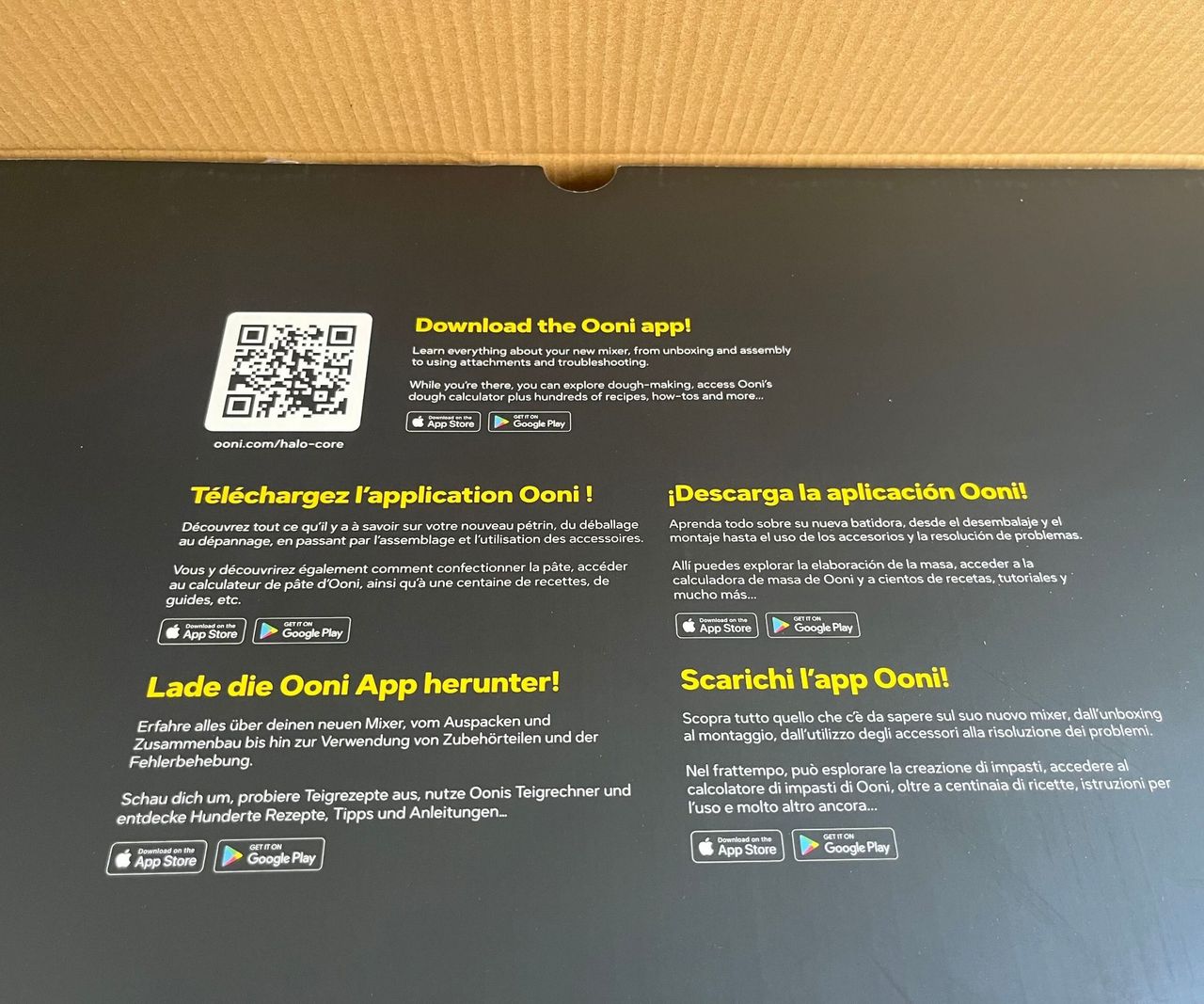 A black piece of cardboard with a QR code on it, and instructions to scan it for more details