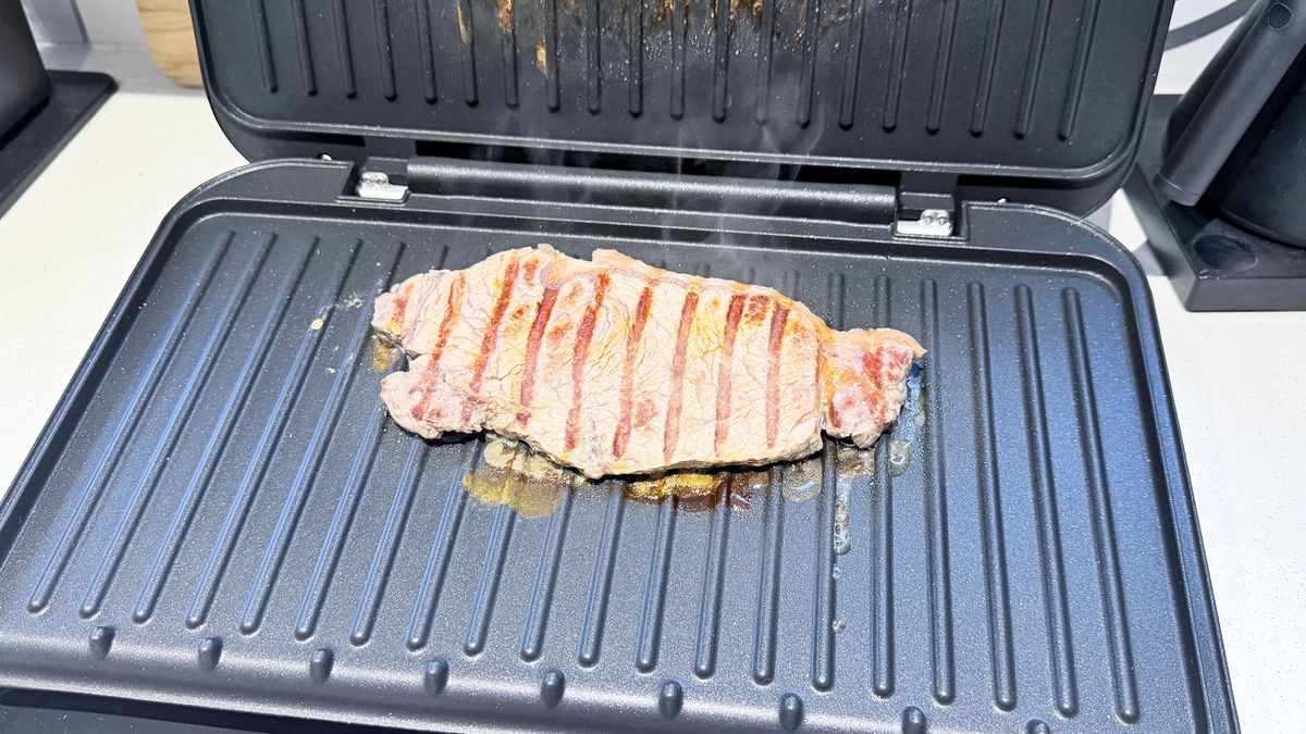 A steak being cooked on the George Foreman Grill