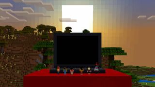 minecraft characters standing around a large laptop