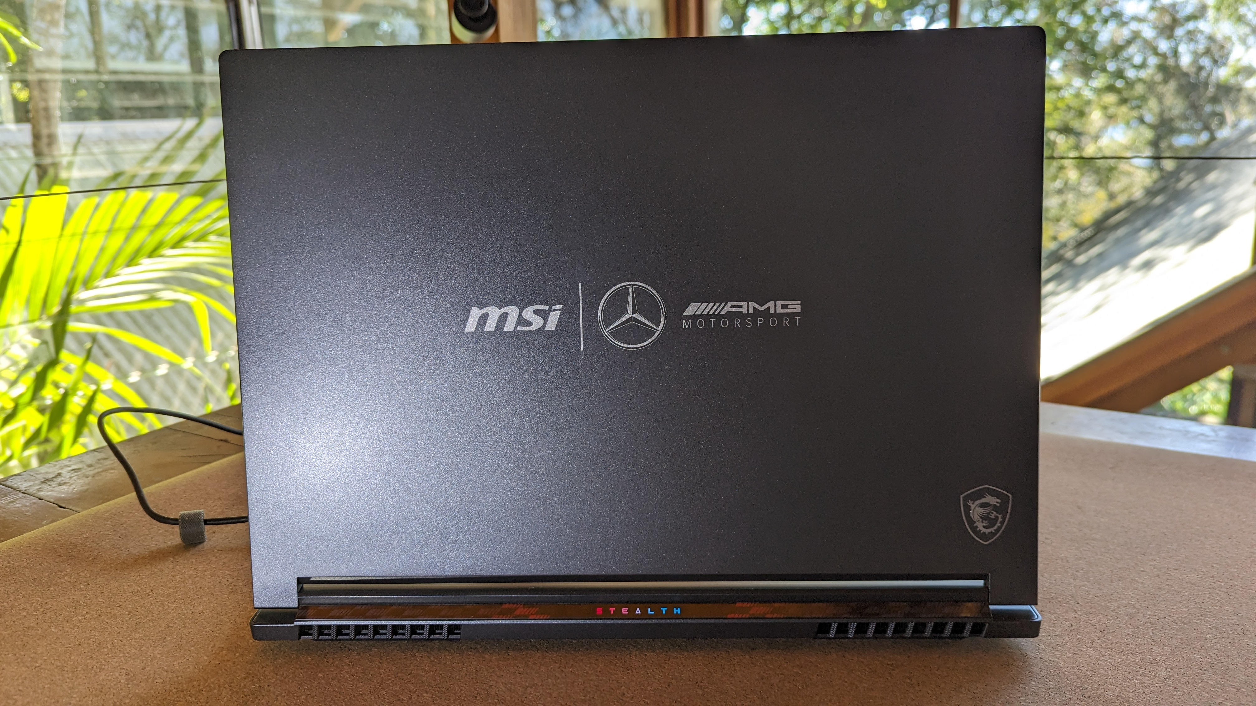 MSI Stealth 16 playing F1 on a yoga mat