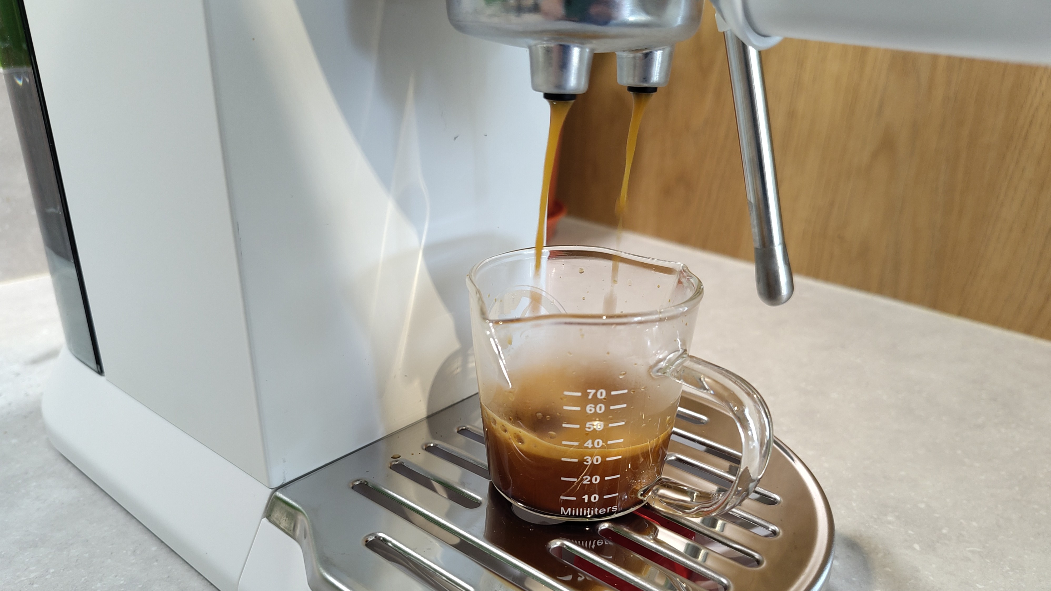De&#039;Longhi Dedica Duo espresso machine dispensing espresso
