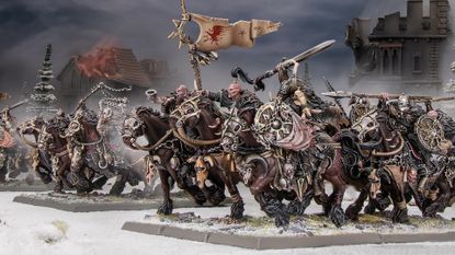 Marauder Horsemen models charge forward across a snowy battlefield 