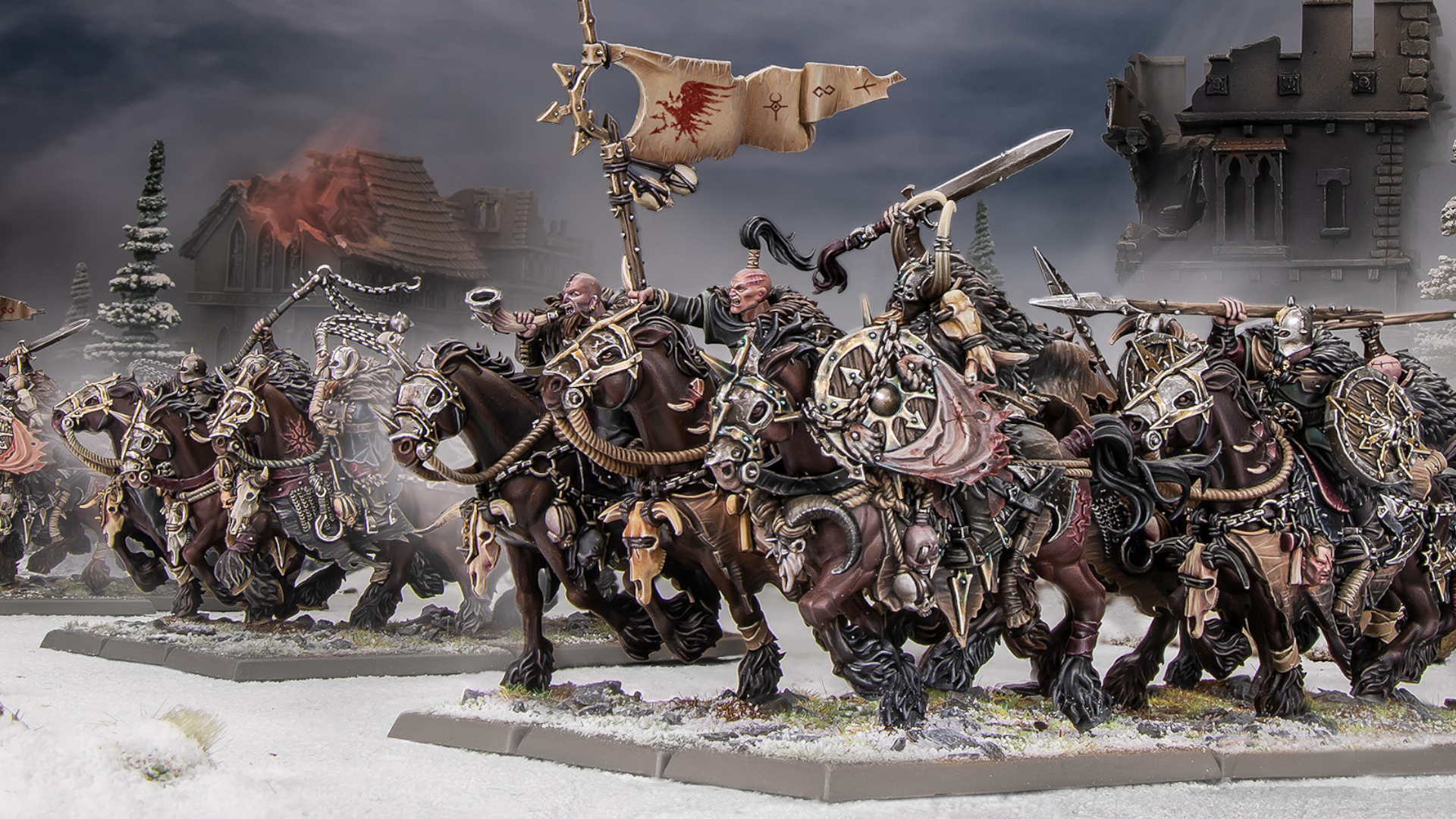 Marauder Horsemen models charge forward across a snowy battlefield