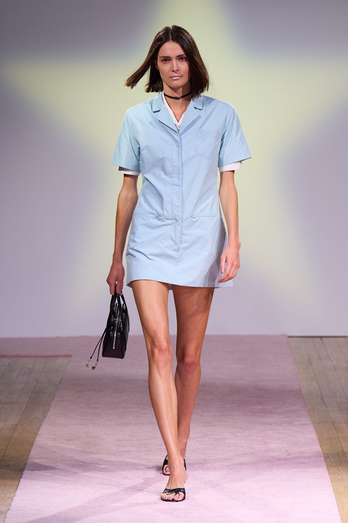 Model wears the baby blue color trend on the runway.