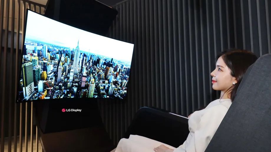 LG Media Chair on display at showroom with woman sitting in it