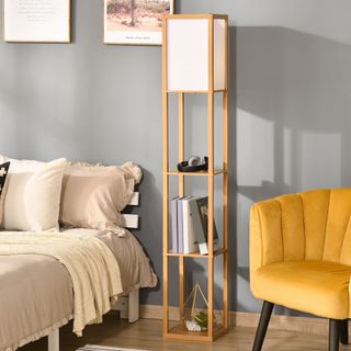 HOMCOM Modern 3 Tier Floor Lamp with Shelves in a bedroom