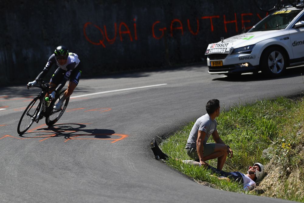 Edward Theuns of Trek-Segafredo lies injured after a crash during the 37km Individual Time Trial stage 13 of the Tour de France