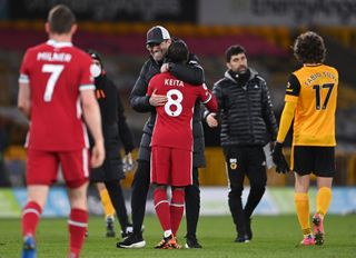 Liverpool manager Jurgen Klopp celebrates with Naby Keita