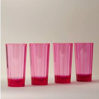 Pink glasses on white background