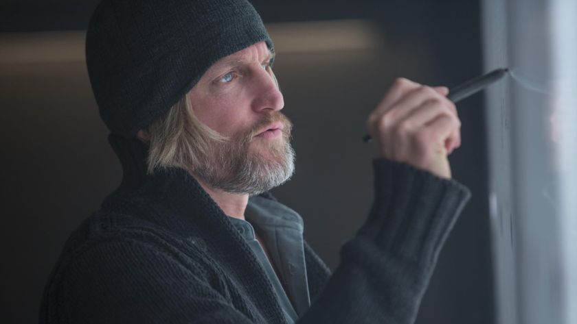 Haymitch draws on a board in The Hunger Games