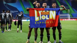 Memphis Depay, Rayan Cherki and Houssem Aouar of Olympique Lyon celebrate following their team's victory in the UEFA Champions League quarterfinal match on August 15. Lyon faces Paris Saint-Germain in a semifinal.