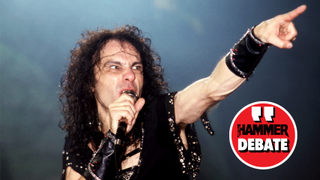 Ronnie James Dio on stage singing and pointing