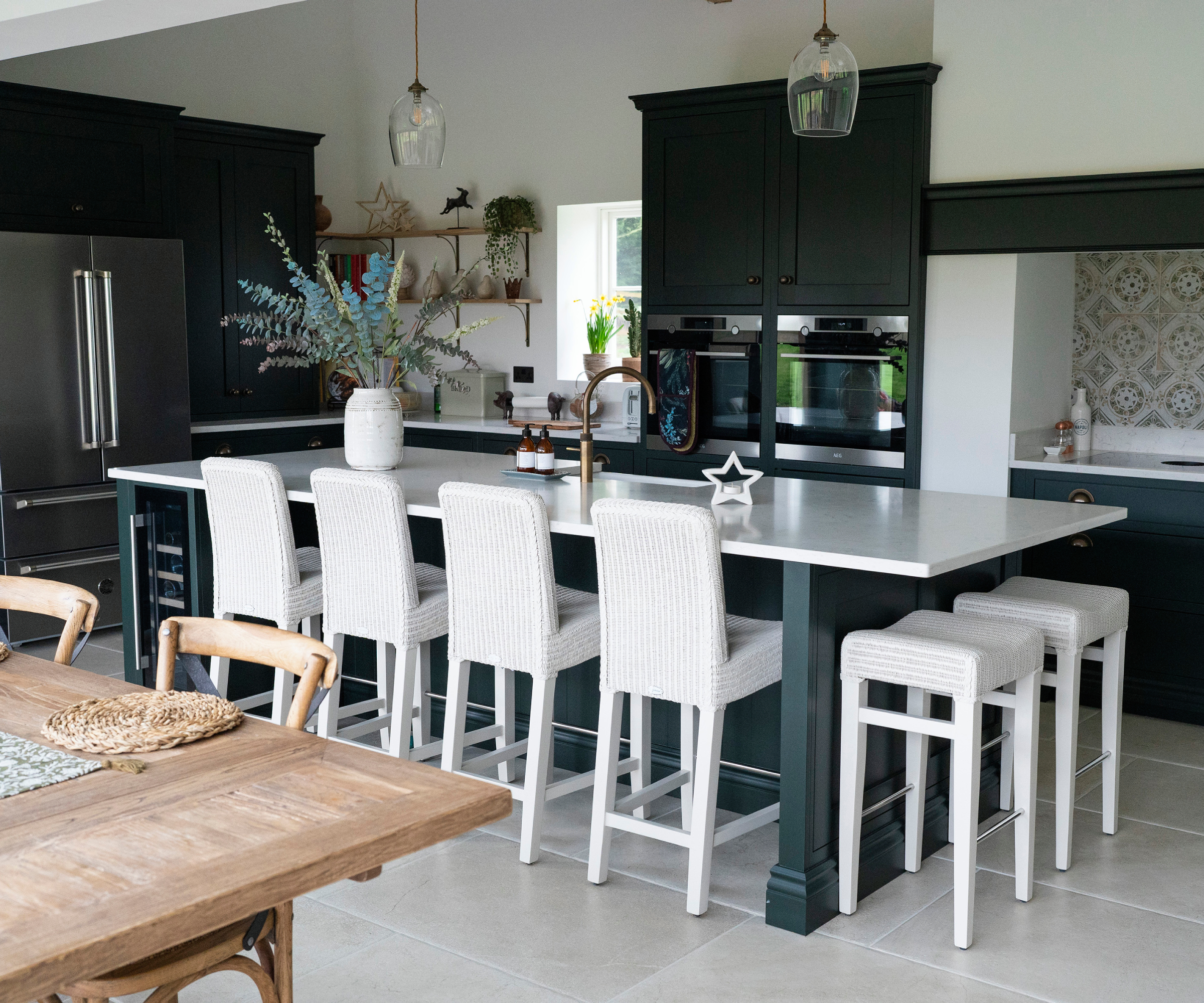 large island with stools and chairs on two sides