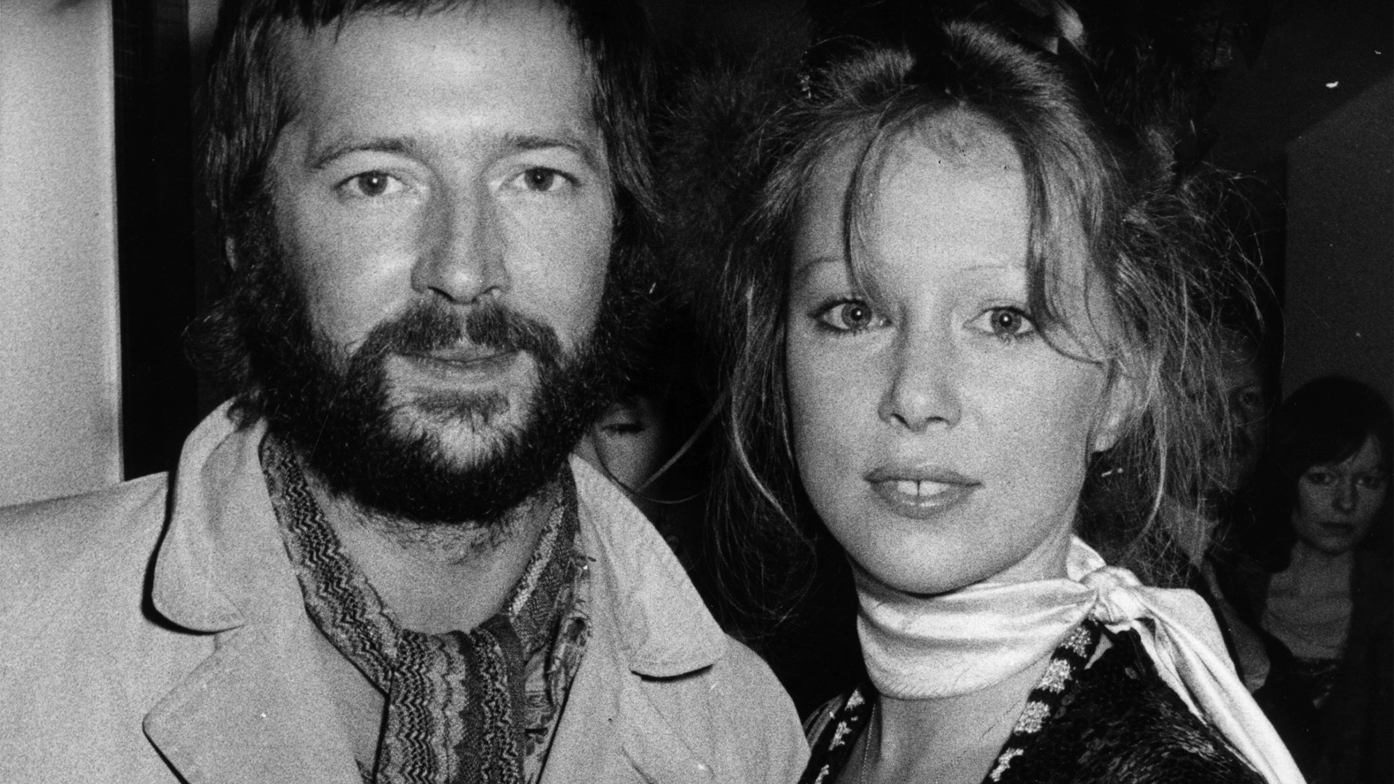 Eric Clapton and his girlfriend fashion model Patti Boyd, ex-wife of ex-Beatle George Harrison, attend the premiere of the rock musical film 'Tommy' in London's Leicester Square, 26th March 1975.
