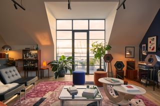 Interior of living space looking out to dusky skies at East London loft apartment