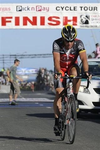 Lance Armstrong crosses the line in 9th place.