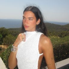 Dua Lipa wears a thong-exposing dress in Ibiza