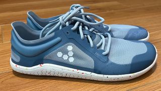 Vivobarefoot Primus Lite III Review on a wooden floor