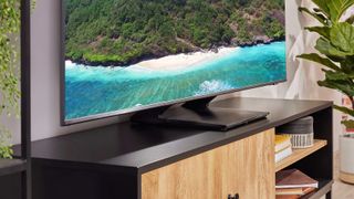 Samsung Q70A on wooden TV bench