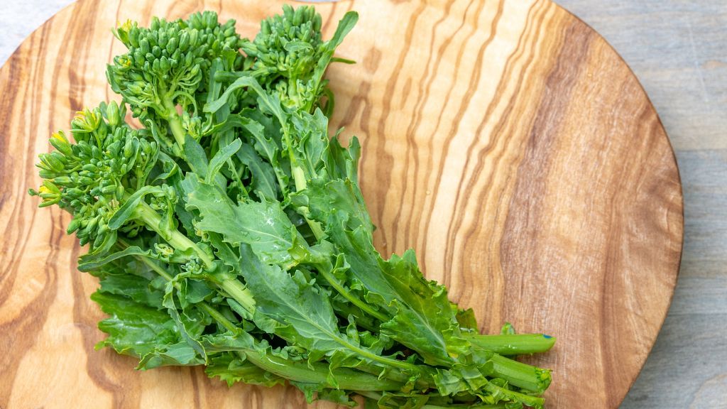 fresh rapini on cutting board 