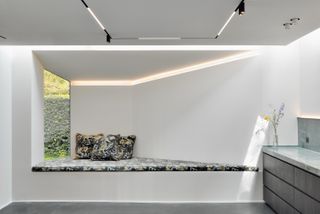 White interior and window seat inside Wood Art Pavilion by Labscape