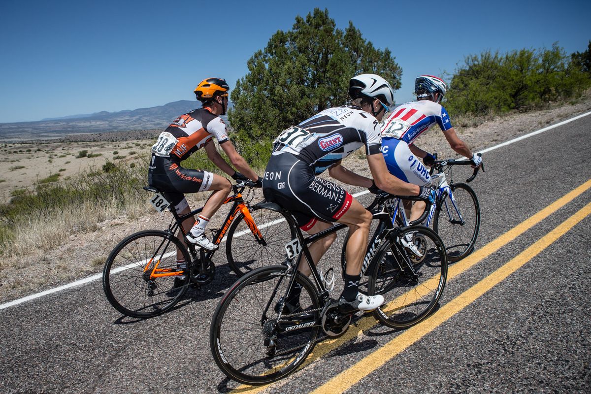 Three chasers in the mens race hit the final climb