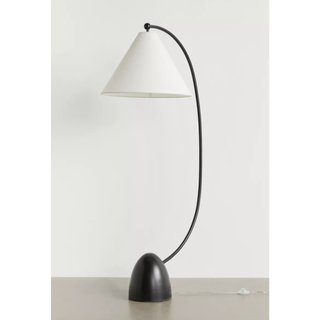 floor lamp with black base and arched arm