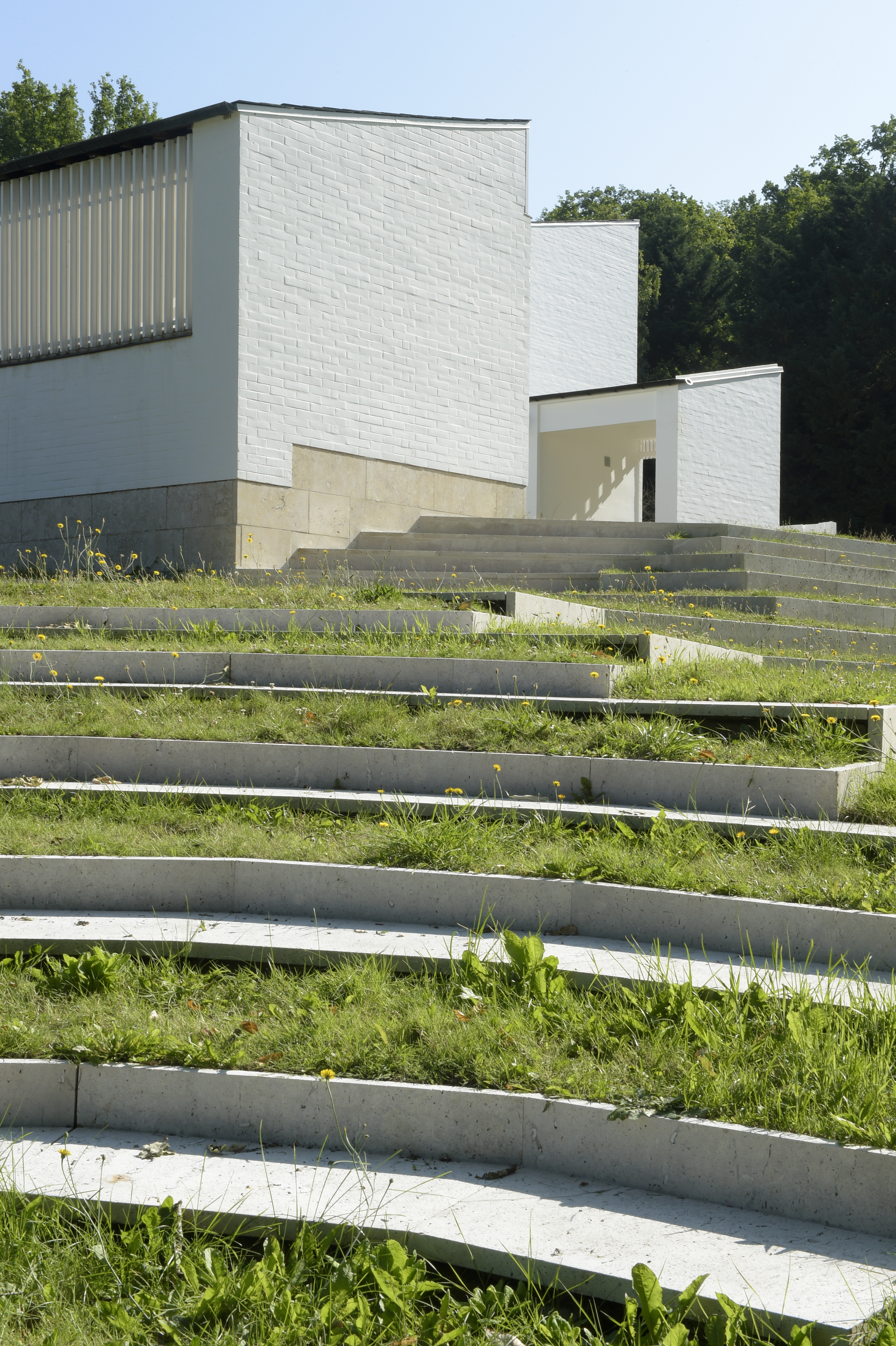 the white, clear, crisp and restored Maison Louis Carre by Alvar Aalto against blue skies