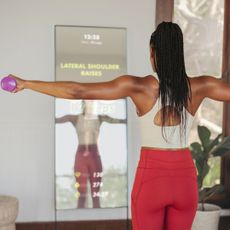 Wellness products 2023: A woman working out at home