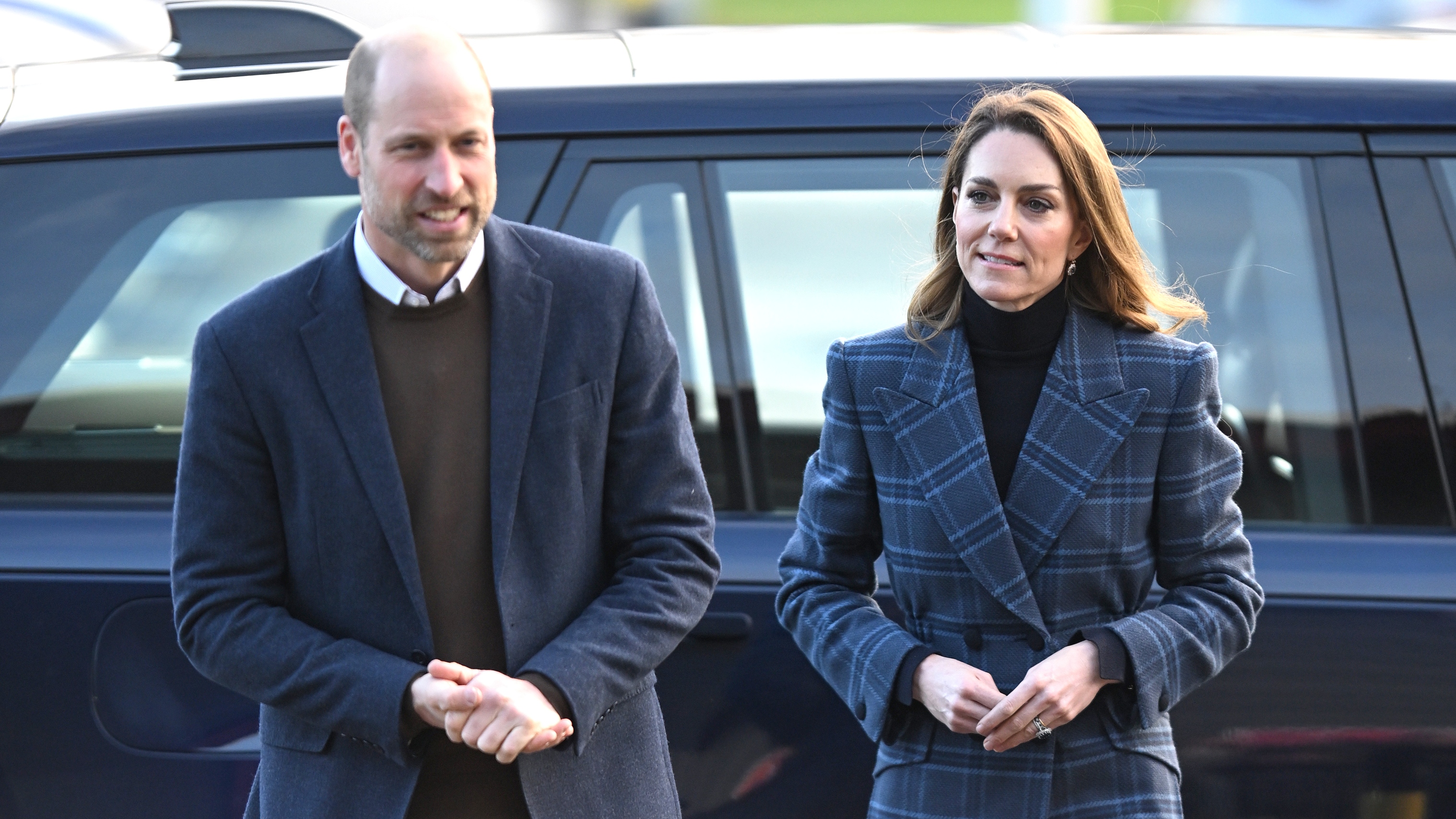 Prince William and Catherine, Princess of Wales smile as they arrive for a visit to the National Curling Academy on January 20, 2026