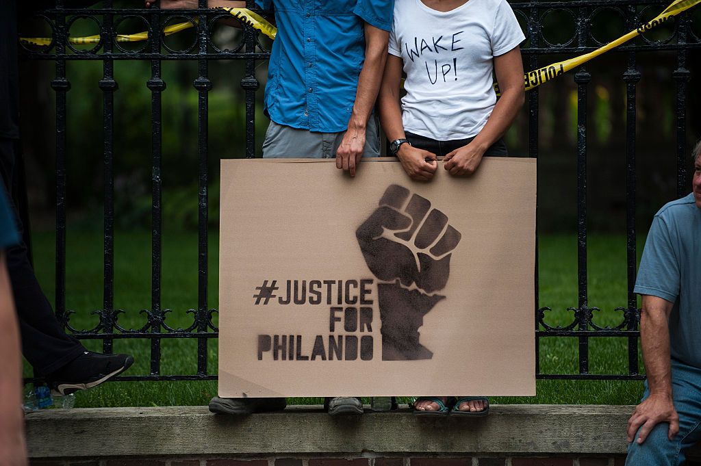 A protester holds a sign reading, &amp;quot;Justice for Philando&amp;quot;