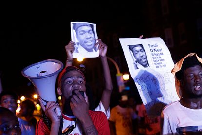 Demonstrators protest the fatal police shooting of Paul O'Neal on August 5, 2016 in Chicago, Illinois