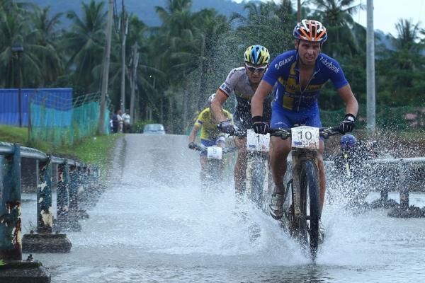 Emil Lindgren (Swe) Rabobank-Giant Offroad Team leads across a river crossing in stage 2 at Langkawi