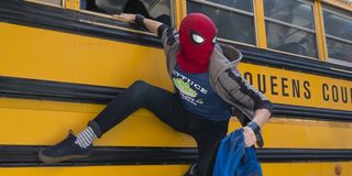 Spider-Man exits a bus