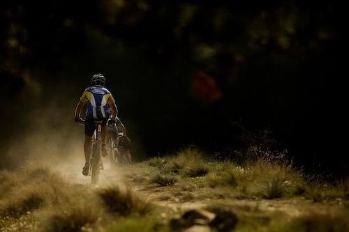 Riders race off into the distance.