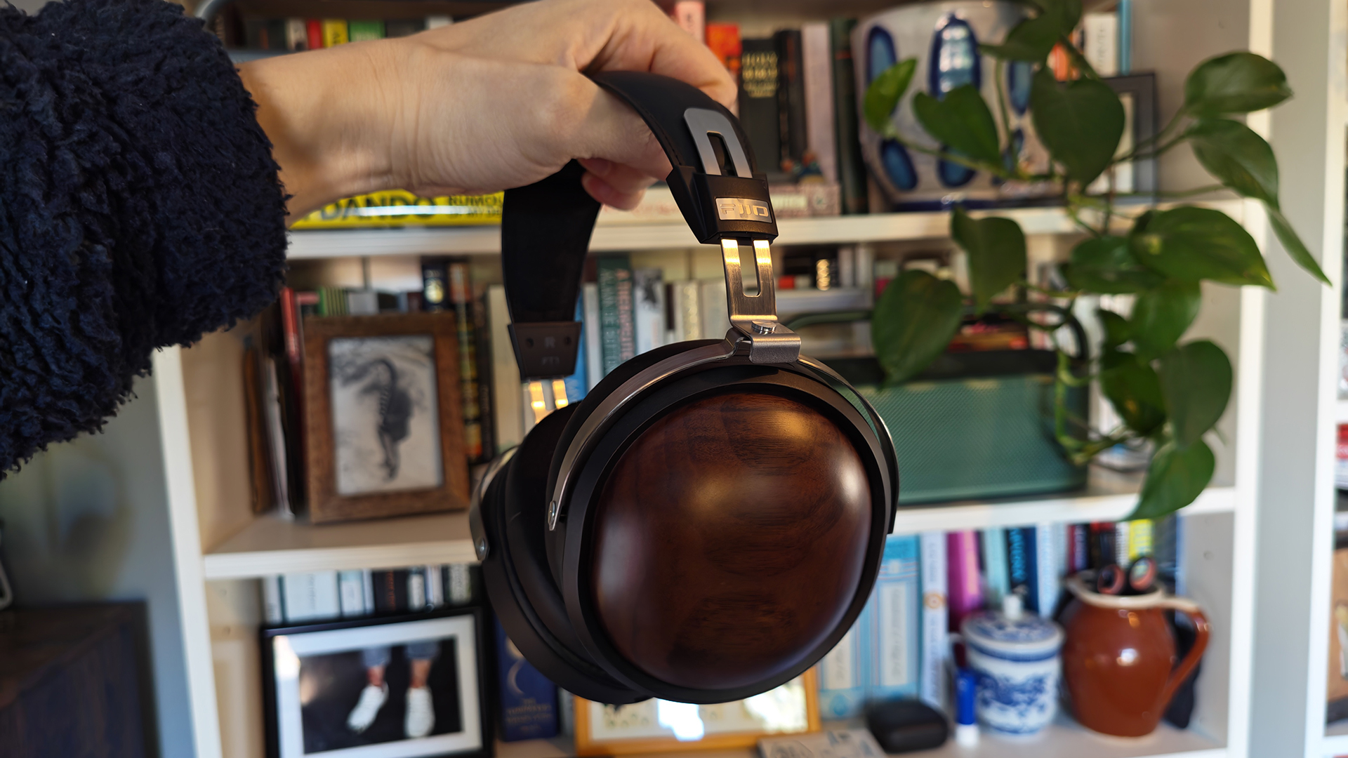 Various photos of the FiiO FT1 headphones, in a home office. 