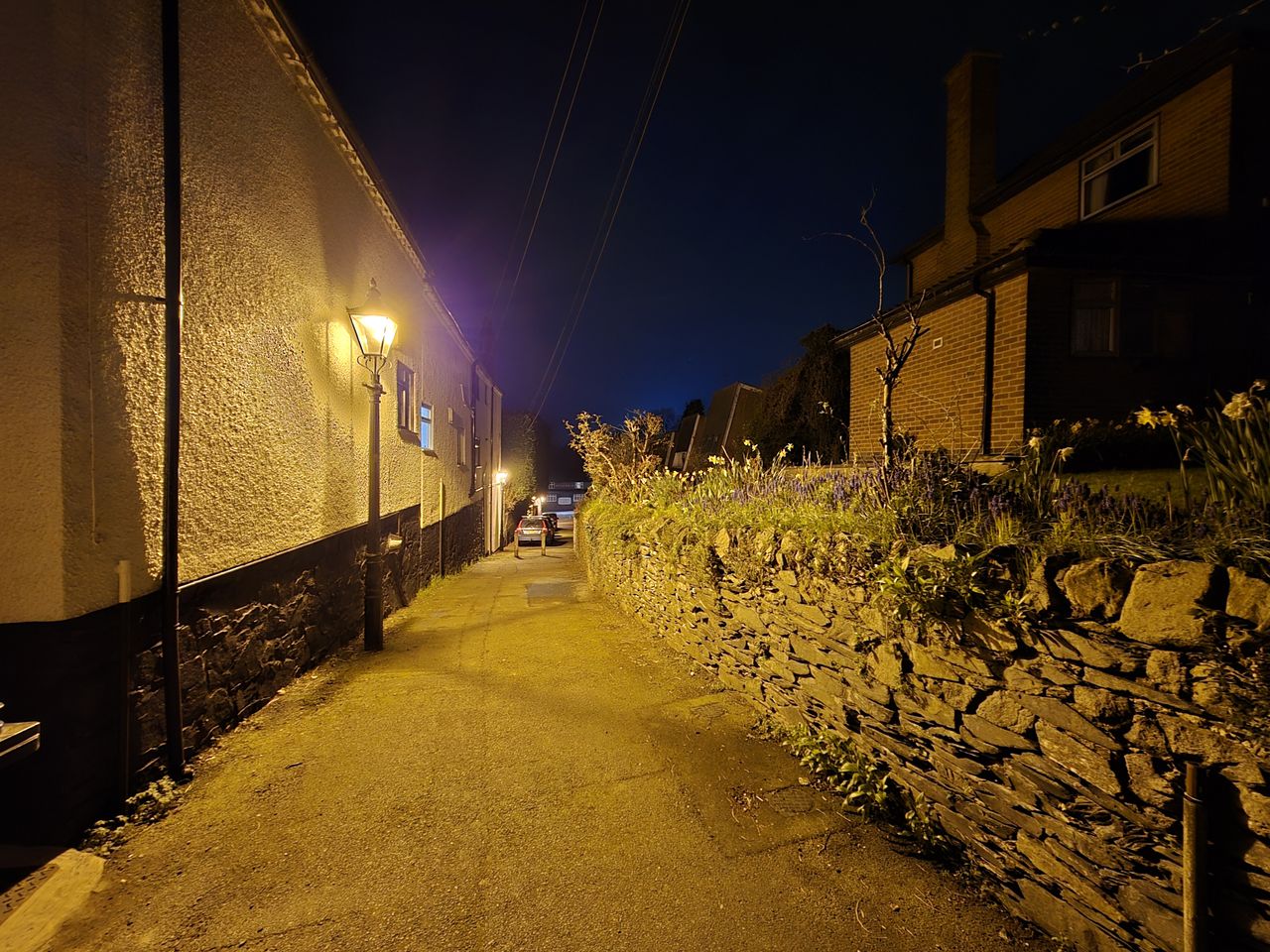 Street at night lit by streetlamps